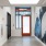 entrance with glass door and painted art on wall