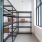 room with shelves with boxes on them and windows