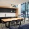 co-working space with seating tables and windows
