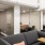a room with a couch and chairs