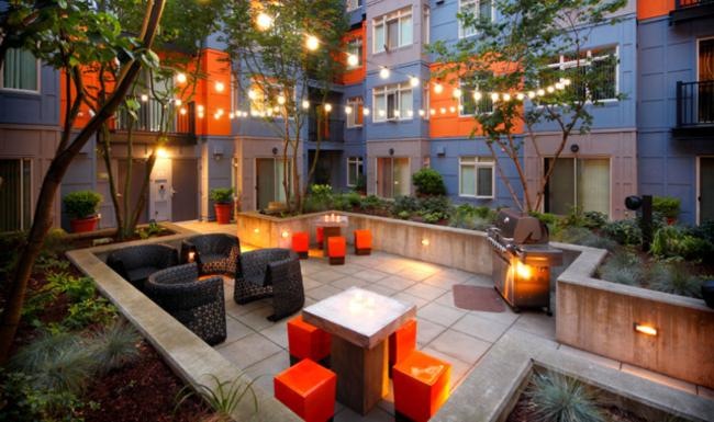 a courtyard with tables and chairs