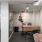 a room with a desk and chairs